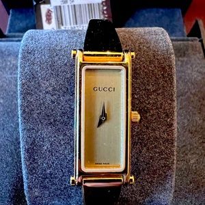 Gucci bangle watch.  Used like new and beautiful statement piece. Very elegant.